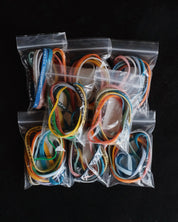 Eight packages with assorted Bible Memory Project wristbands
