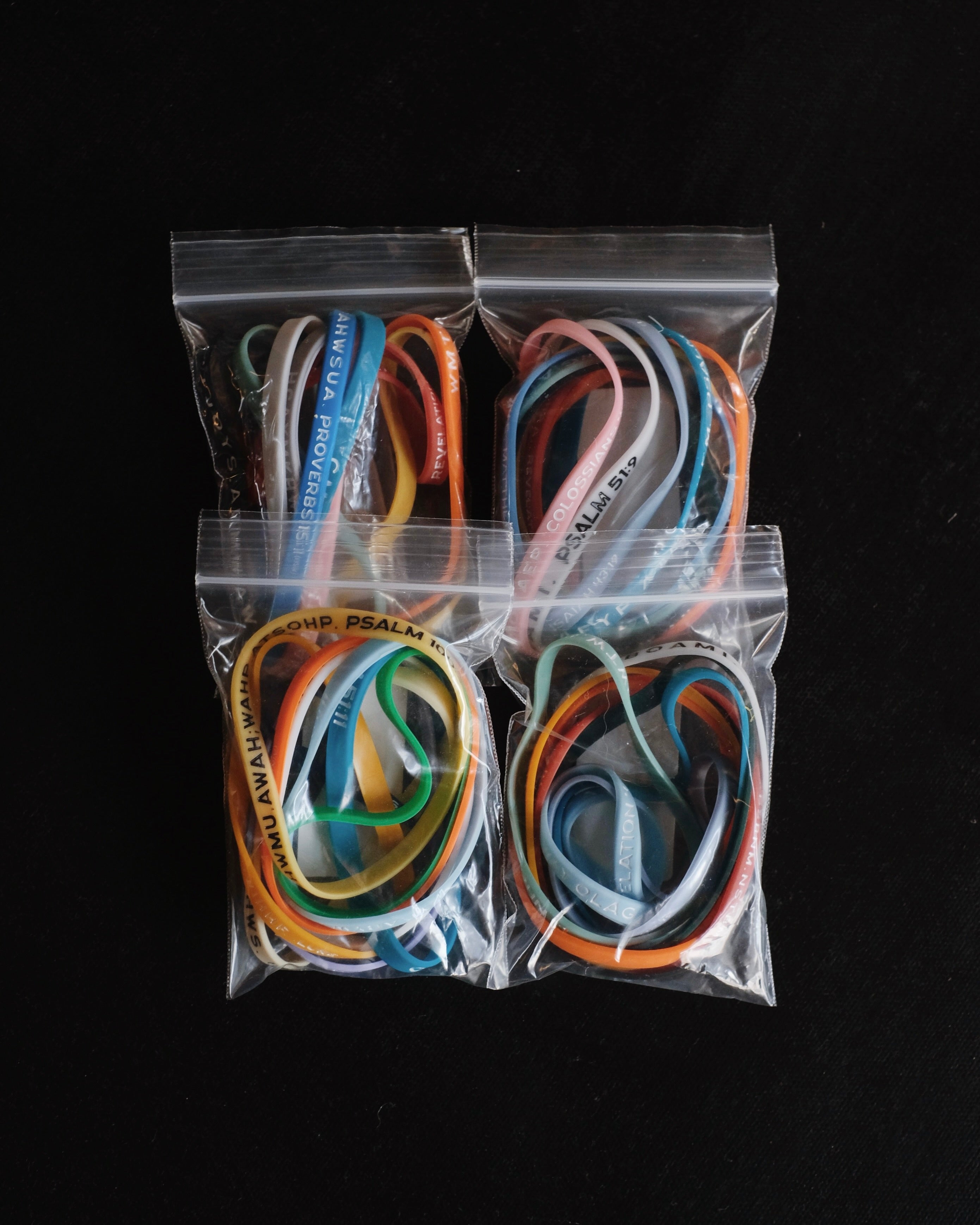 Four packages with assorted Bible Memory Project wristbands