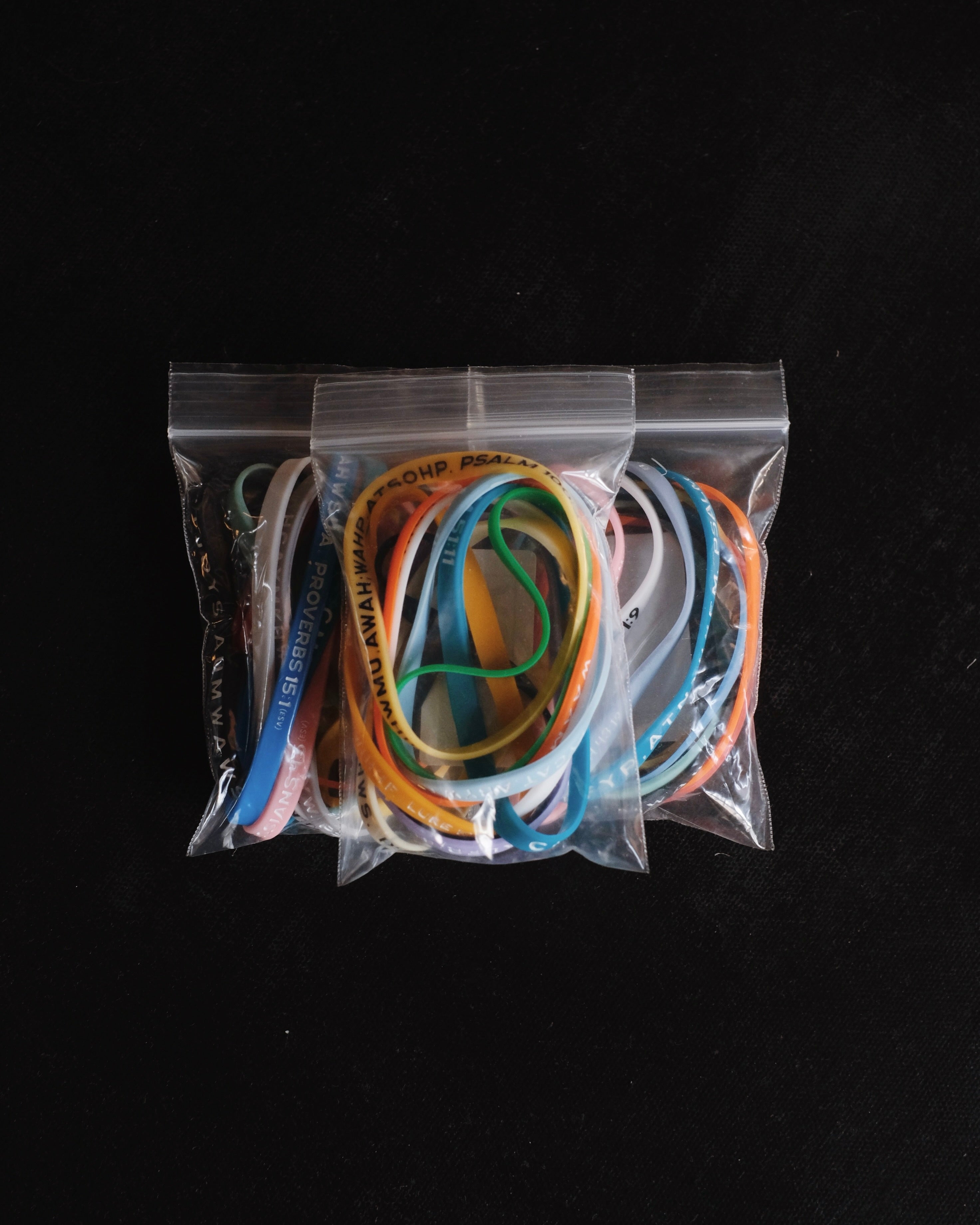 Three packages with assorted Bible Memory Project wristbands