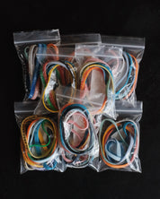 Nine packages with assorted Bible Memory Project wristbands