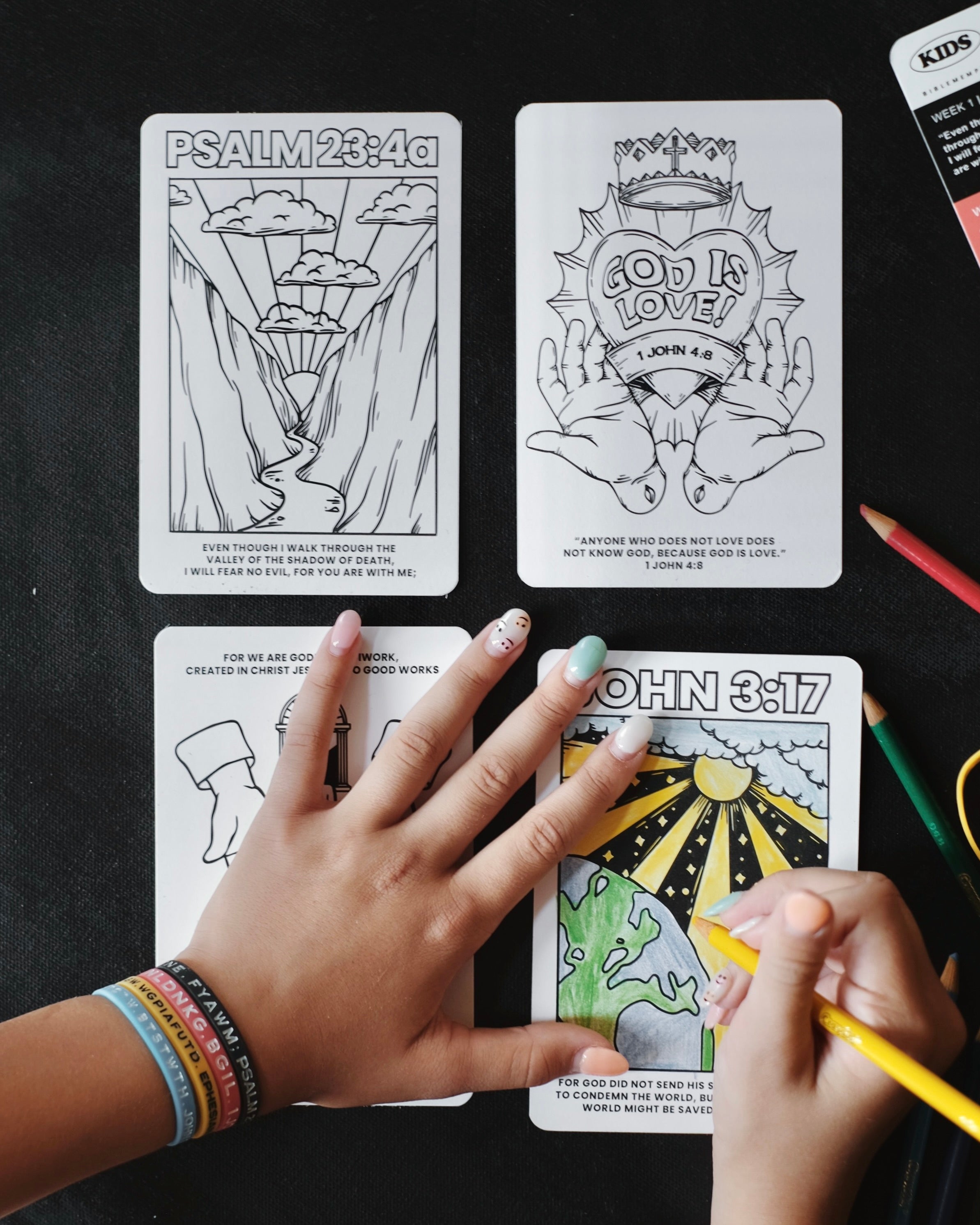 Person coloring a Bible Memory Project coloring page