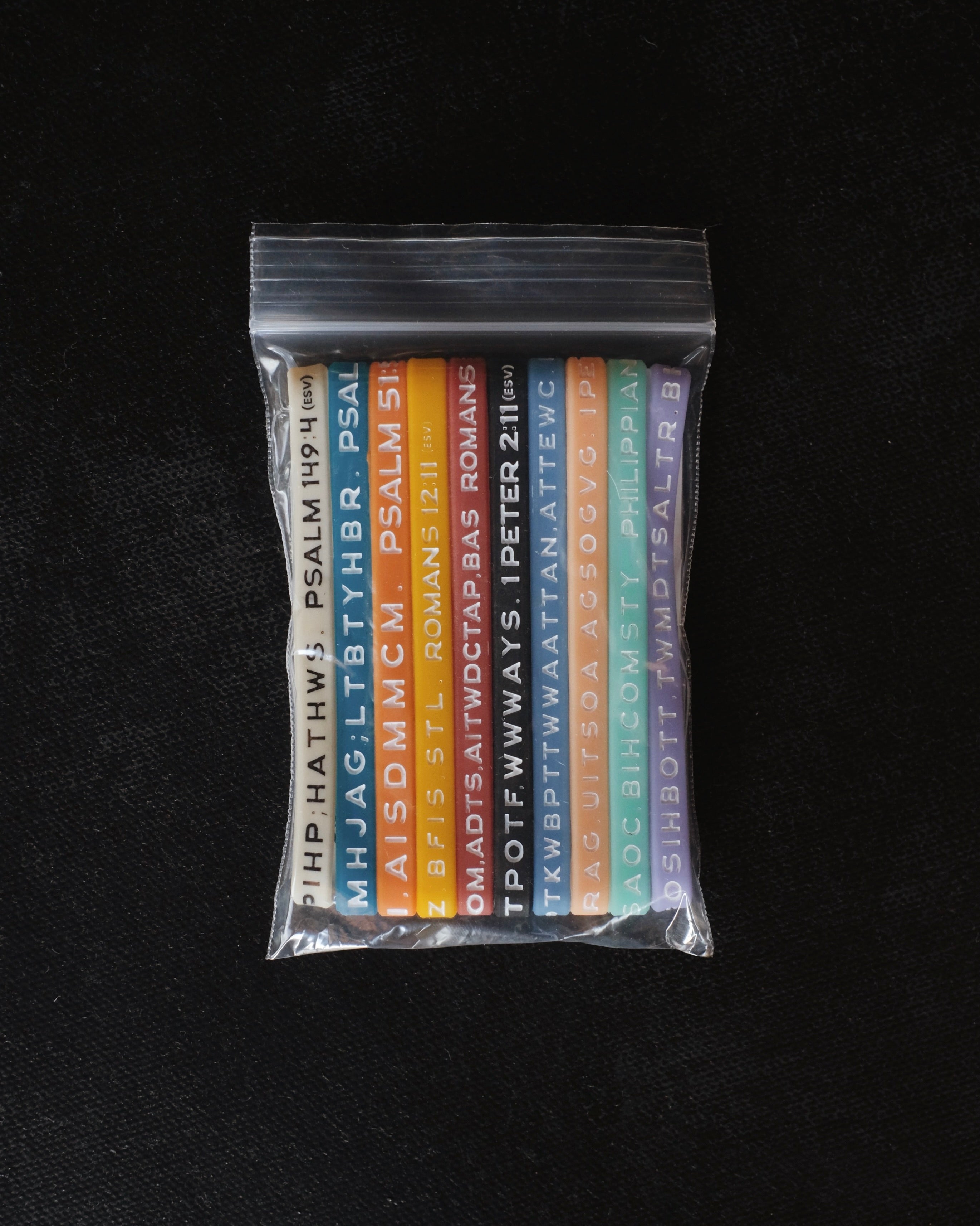 A package with assorted Bible Memory Project wristbands