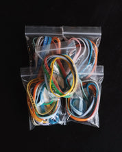 Five packages with assorted Bible Memory Project wristbands