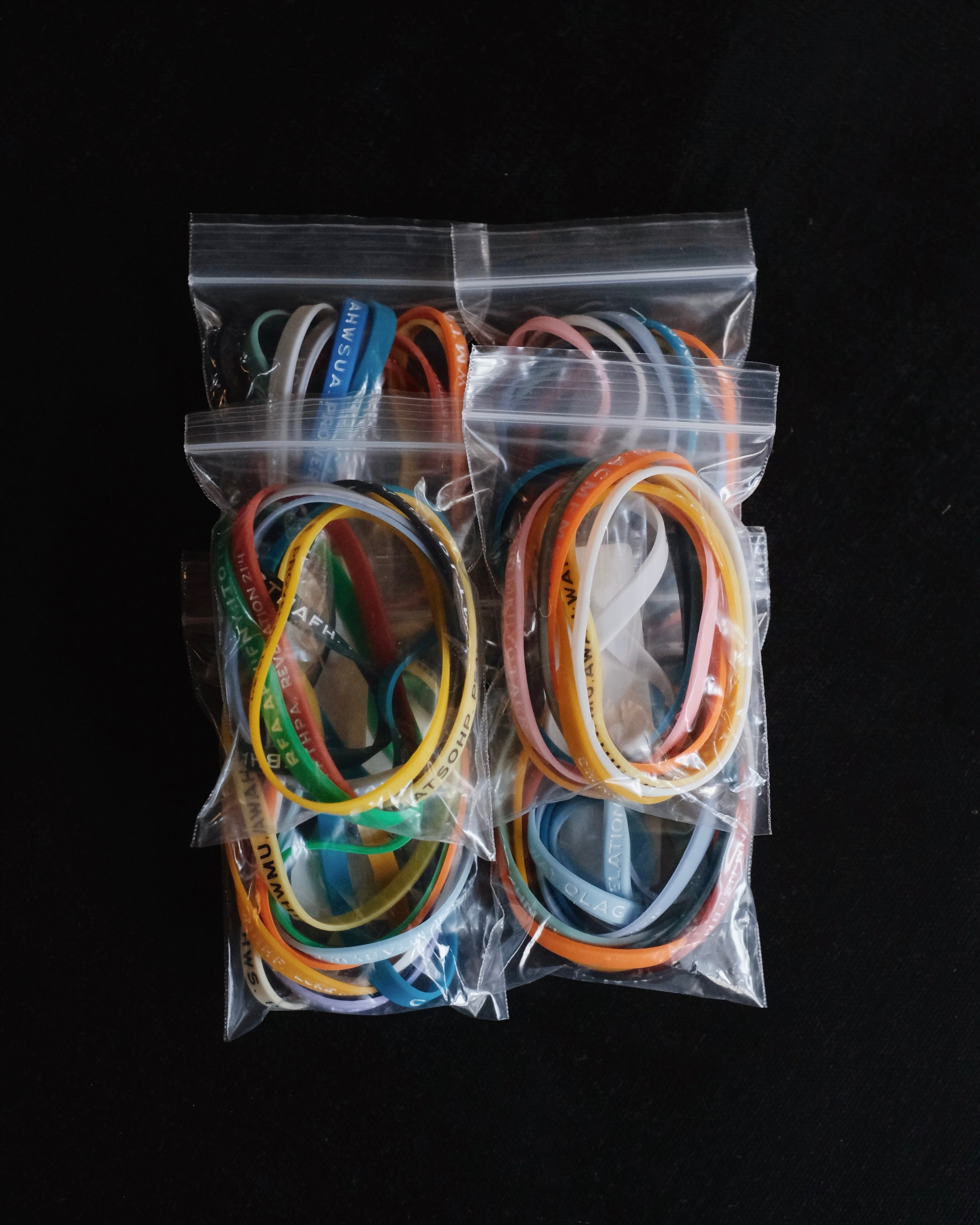 Six packages with assorted Bible Memory Project wristbands