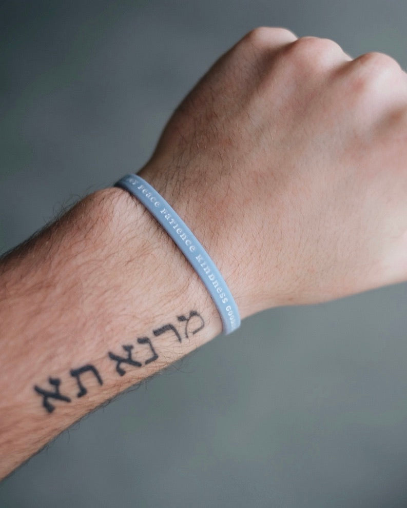 Baby blue Bible Memory Project wristband on a wrist