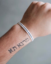 White Bible Memory Project wristband on a wrist