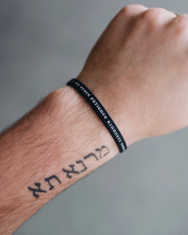 Black Bible Memory Project wristband on a wrist