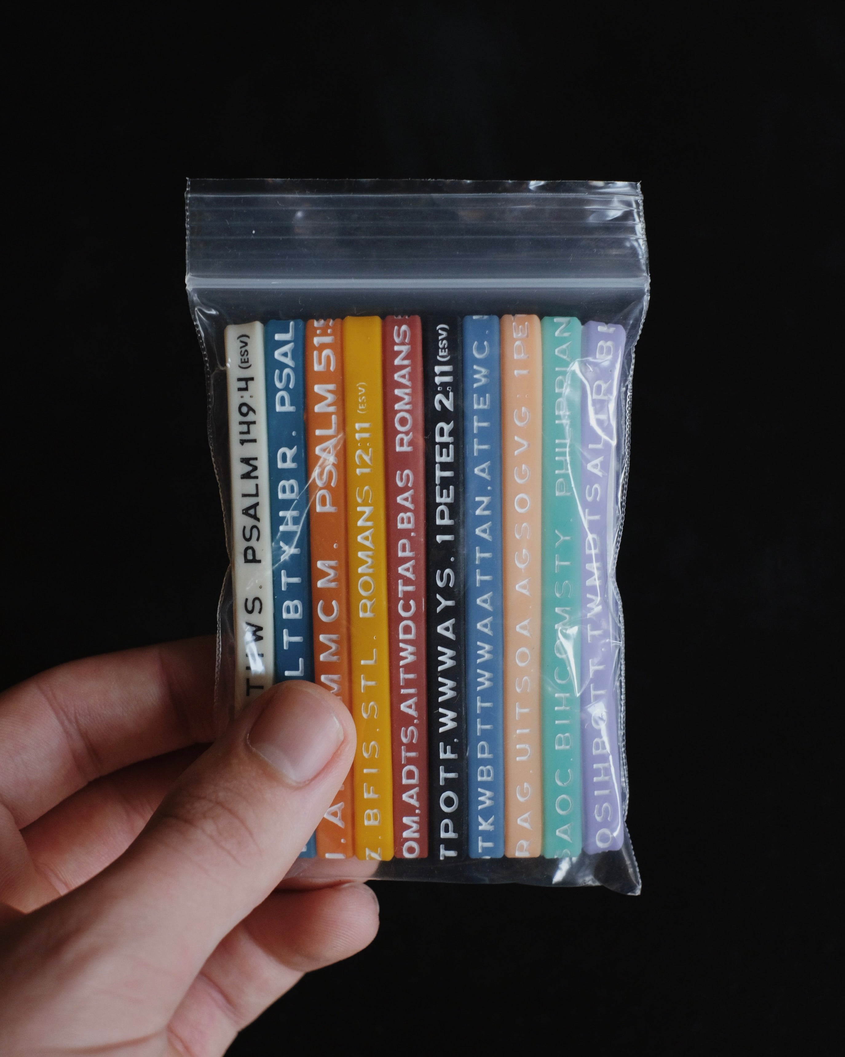 A package with assorted Bible Memory Project wristbands